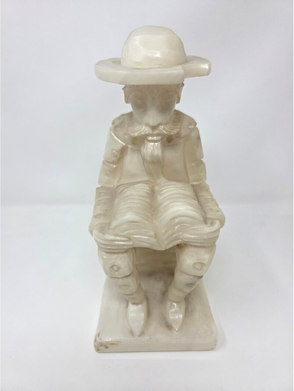Hand-Carved Alabaster Figure Of Seated Man Reading With Hat And Beard